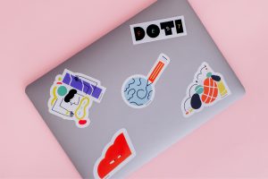 Laptop with DOTI Fest stickers