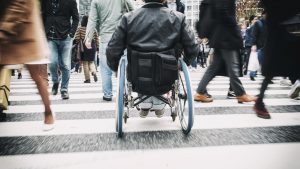 A man in a wheelchair in the Shibuya Ward of Tokyo, Japan.